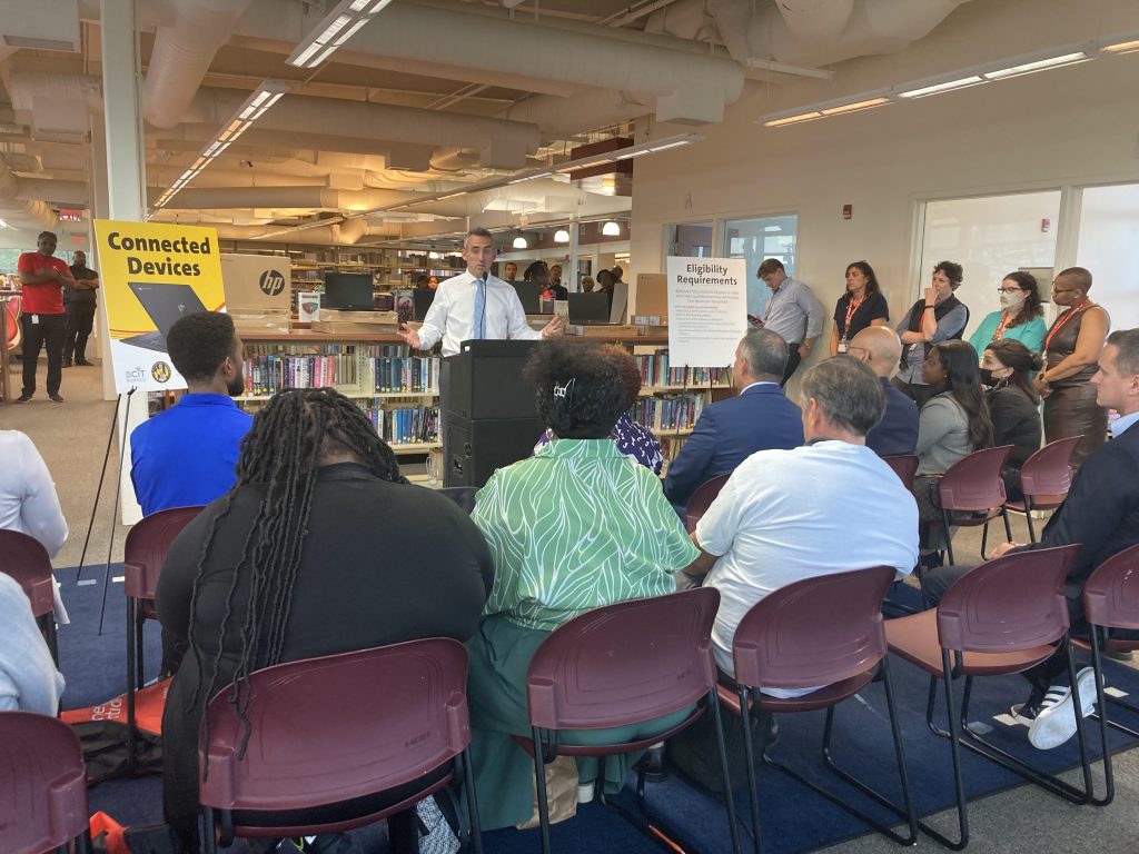Secretary Jake Day speaks to officials and families receiving devices at an event at the beginning of Digital Inclusion Week in Baltimore City