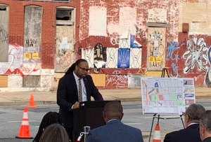 DHCD Assistant Secretary Greg Hare provides remarks at the ribbon cutting of the first four homes renovated through the Homeownership Works program.

