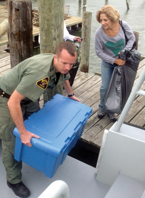 Natural Resources Police helping a Crisfield resident evacuate; department photo