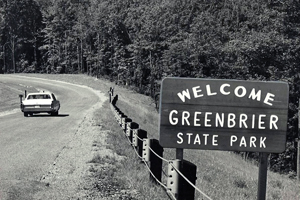 Photo of: Welcome sign and entering vehicle in 1967
