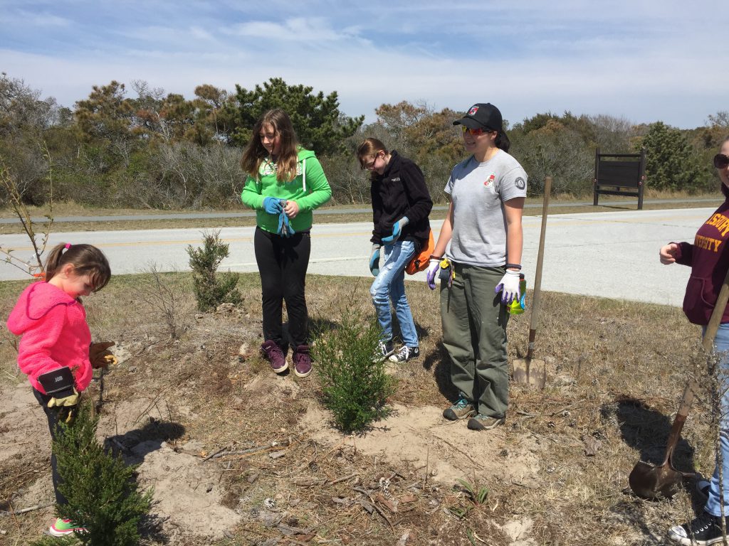 Maryland Conservation Corps members help students plant trees