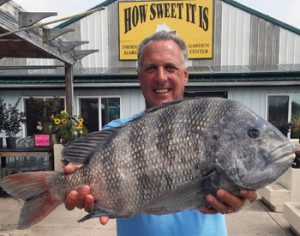 Photo of: man holding large fish