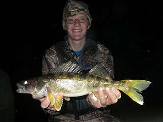 Photo of youth holding walleye