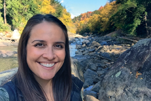 Photo of: Kim in front of river in fall