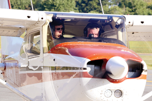 Photo of: biologists in plane ready to take flight