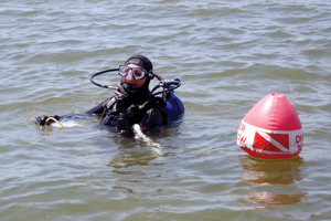 Photo of: Woman in water in scuba gear