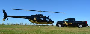 Photo of Maryland Natural Resources Police helicopter and truck