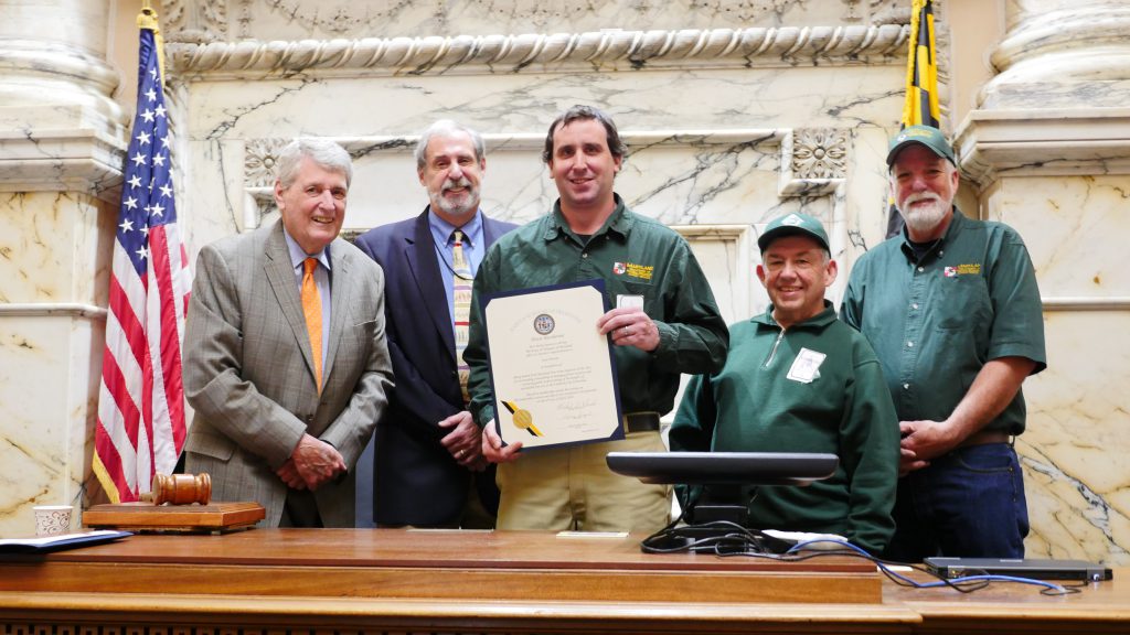 Photo of Maryland Forester Sean Weaver with officials and staff