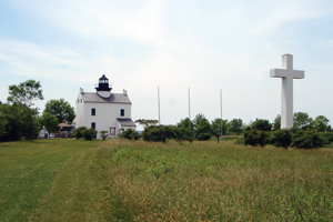 Photo of lighthouse and cross