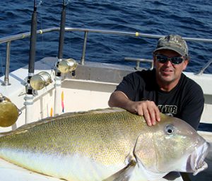 Photo of man with large, tan fish