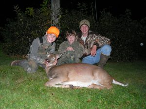Photo of children with a deer