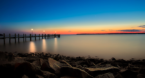 Photo of bay pier at sunset