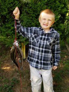 Photo of boy with rainbow trout