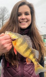 Photo of girl with yellow perch