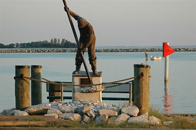 Statue of oysterman on pier in Rock Hall