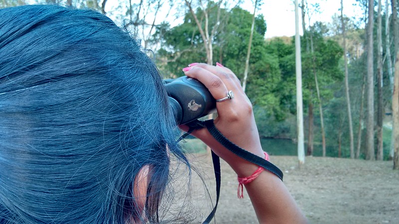 Photo of woman using binoculars
