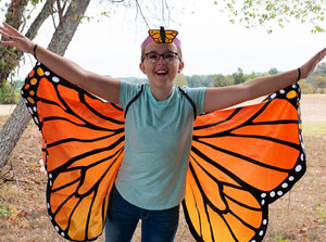 Girl dressed up as a monarch butterfly