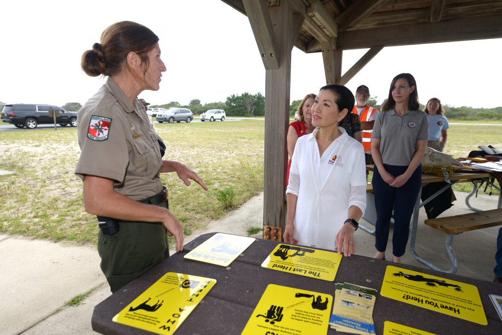 Photo of first lady discussing park signage with ranger