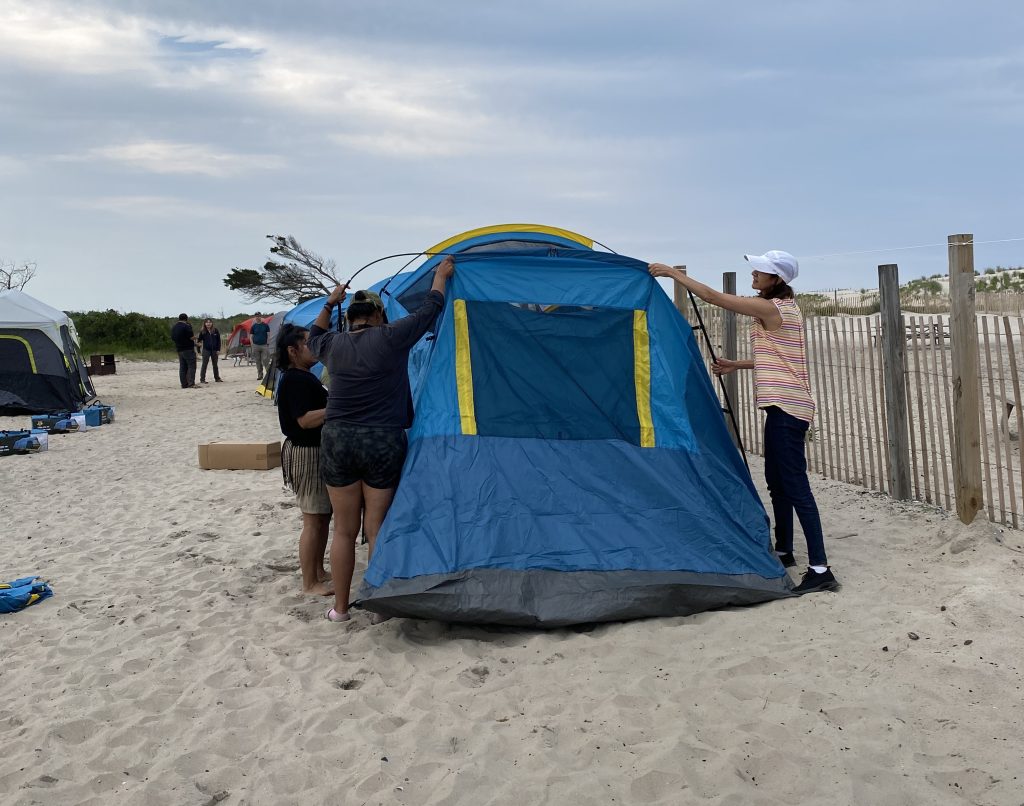 Photo of people camping on a beach