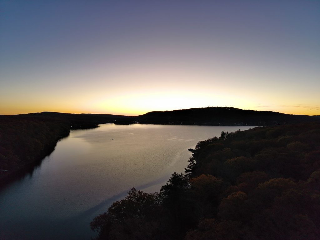 Sun setting behind Deep Creel Lake, the lake level is very low because of the lack of rain.