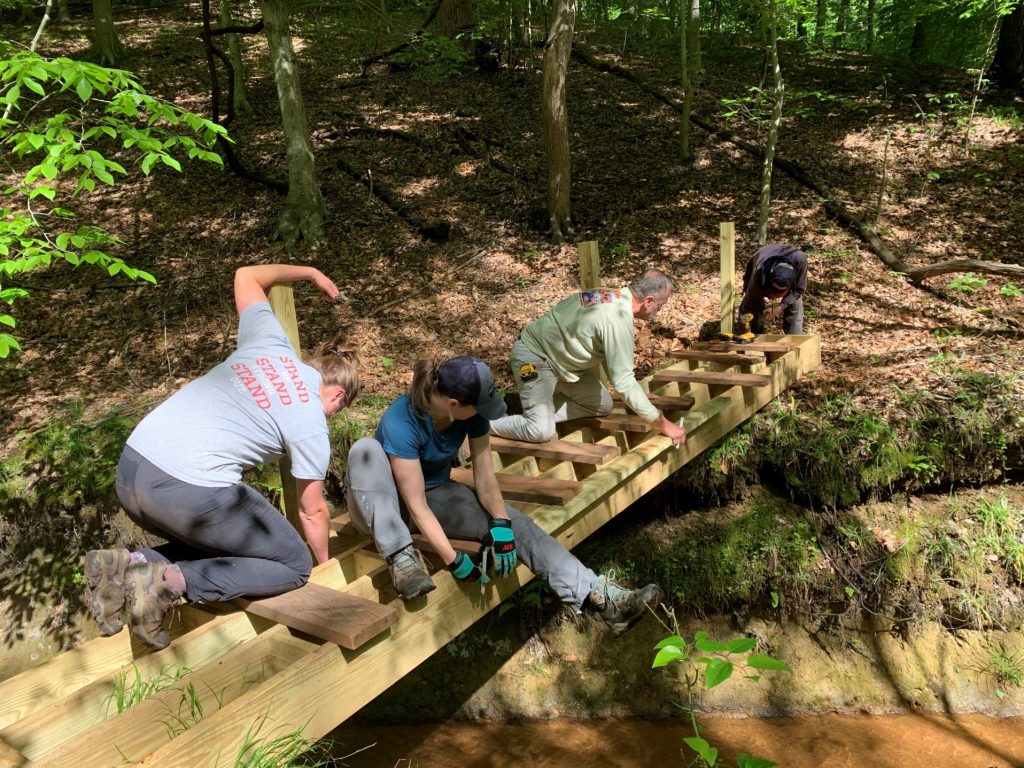 Photo of several people working on a garden project