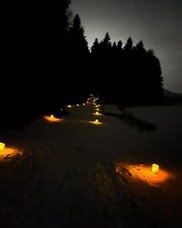 Mountain trail lighted by candles at night