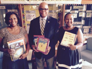 Pictured from left to right: -Librarian Leslie Powell, Deputy Secretary of Operations Wendell France, and Principal Erita Adams