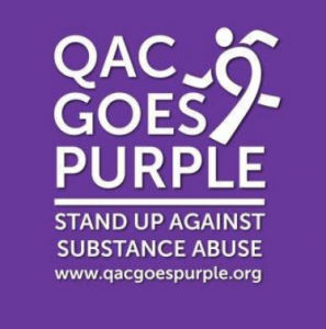 Queen Anne's County Goes Purple Logo. A Purple square with white lettering that says Q.A.C. Goes Purple Stand up. against substance abuse. www.qacgoespurple.org