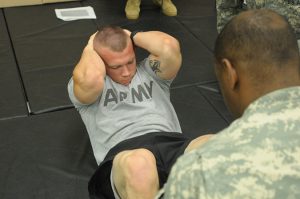 Spc. Christopher M. Hoffman a soldier in 1-169th out of Edgewood, Md., does sit ups as part of the Army Physical Fitness Test at Fort Pickett, Va. on May 29, 2015. The Region II Best Warrior Competition events included the Army Physical Fitness Test, Land Navigation, Marksmanship, several Warrior Tasks and a Board.(Photo by Staff Sgt. Nancy Spicer, 29th Mobile Public Affairs Detachment)