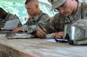 Spc. Christopher M. Hoffman and Staff Sgt. Brandon J. Kennedy study their maps and plots their points for the Land Navigation Task at Fort Pickett, Va., on May 29, 2015. The Region II Best Warrior Competition events included the Army Physical Fitness Test, Land Navigation, Marksmanship, several Warrior Tasks and a Board.(Photo by Staff Sgt. Nancy Spicer, 29th Mobile Public Affairs Detachment)