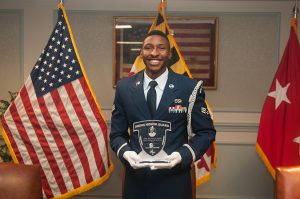 Senior Airman Daniel C. Generette, a member of the Maryland National Guard Honor Guard, received the Honor Guardsman of the Year Award during a ceremony at the 5th Regiment Armory in Baltimore, Md. June 23, 2015. During the ceremony, other Soldiers and Airmen received the 2014 Honor Guardsmen of the Quarter Awards. (Photo by Staff Sgt. Michael E. Davis Jr., Maryland National Guard Public Affairs Office)