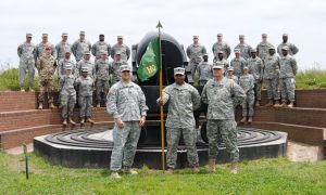 Capt. Thomas Werft, German Army exchange officer, stands with his host unit, Headquarters and Headquarters Detachment of the 115th Military Police Battalion, Maryland National Guard during a tour of Fort McHenry in Baltimore, June 7, 2015.