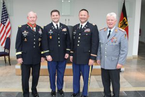 Maryland National Guardsman, Capt. Kurt M. Rauschenberg, and Utah National Guardsman, Lt. Col. Steven A. Fairbourn stand with U.S. Army Gen. Martin E. Dempsey, chairman of the Joint Chiefs of Staff, and German Army Gen. Volker Wieker, Germany’s Chief of Defense, during an award ceremony in Berlin, Germany, Sept. 10, 2015.