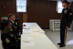 Sgt. Christopher Onyski goes before a board interview with a panel of sergeants major during the 58th Expeditionary Military Intelligence Brigade’s Best Warrior Competition in Glen Arm, Md., on Feb. 20, 2016.