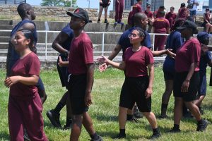 Cadets line up and shake hands after a competition.