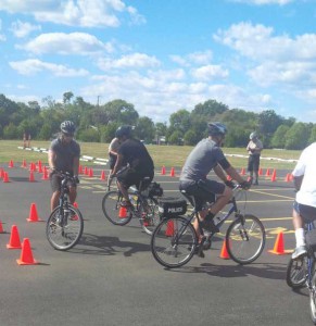 Bike patrol trainees maneuver through an obstacle course.