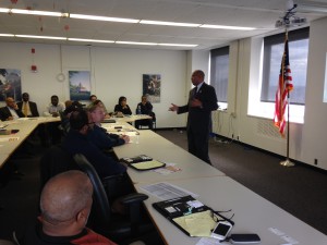 Office of Business Programs Director Jack Howard tells participating contractors what to expect from the information session.
