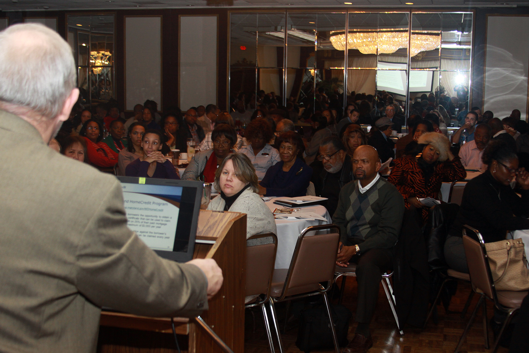 Real estate brokers listen intently as DHCD's Bill Milko leads a ...