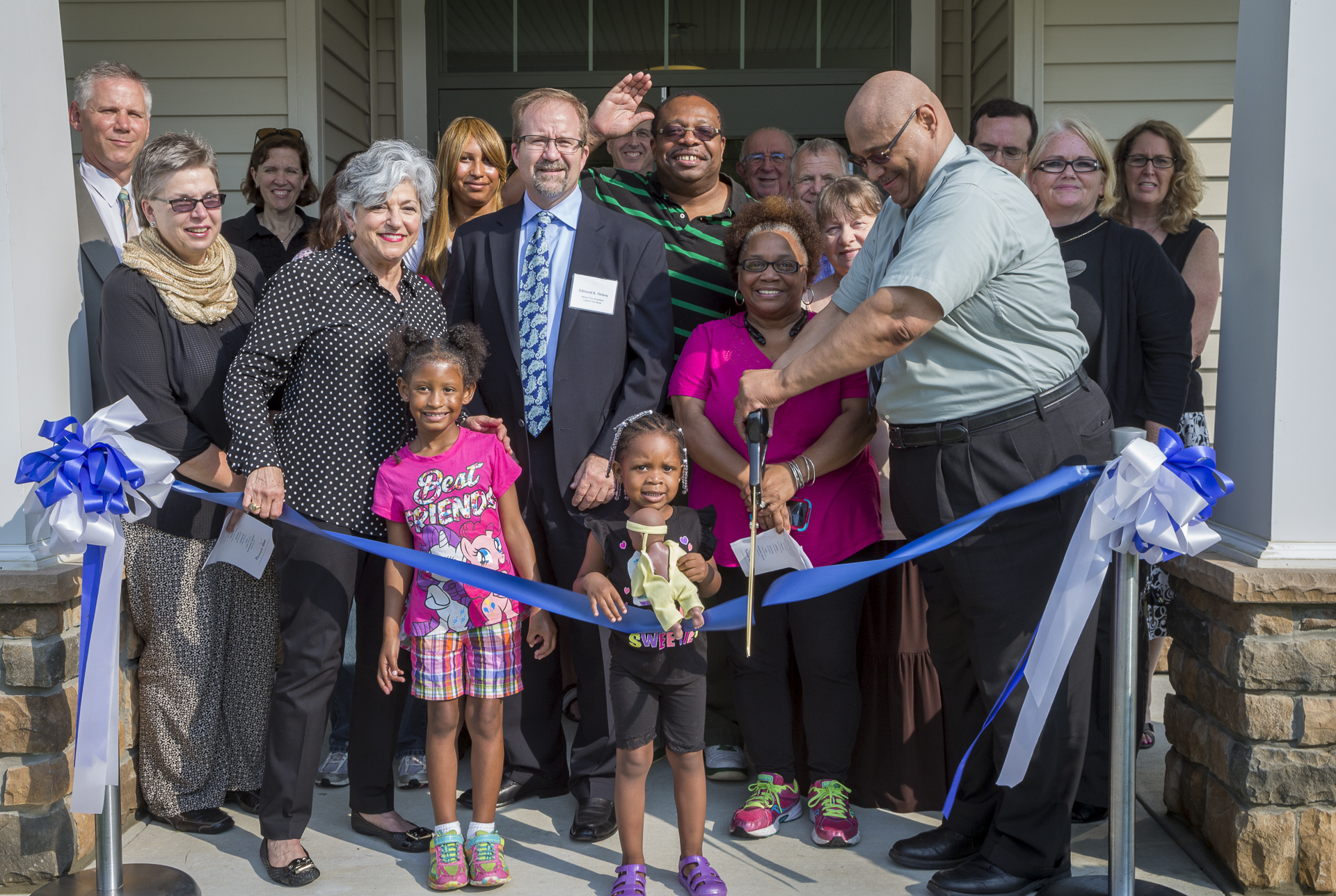 Residents, development leaders and local officials celebrated the opening of Riverwoods at North East Apartments with an official ribbon cutting held Wednesday, June 30. From left: Robert Iber, Director of Baltimore Multifamily Program Center, U.S. DHUD; Chickie Grayson, President, Enterprise Homes; Edmund Delany, Senior VP, Capital One Bank; Paul Stark, Vice Mayor, Town of North East; Ron Wilson, Director of Housing Initiatives, Enterprise Homes; and Christine Caudillo, Property Manager, Habitat America.