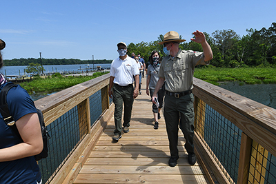 Photo of Lieutenant Governor walking along a pier with a ranger