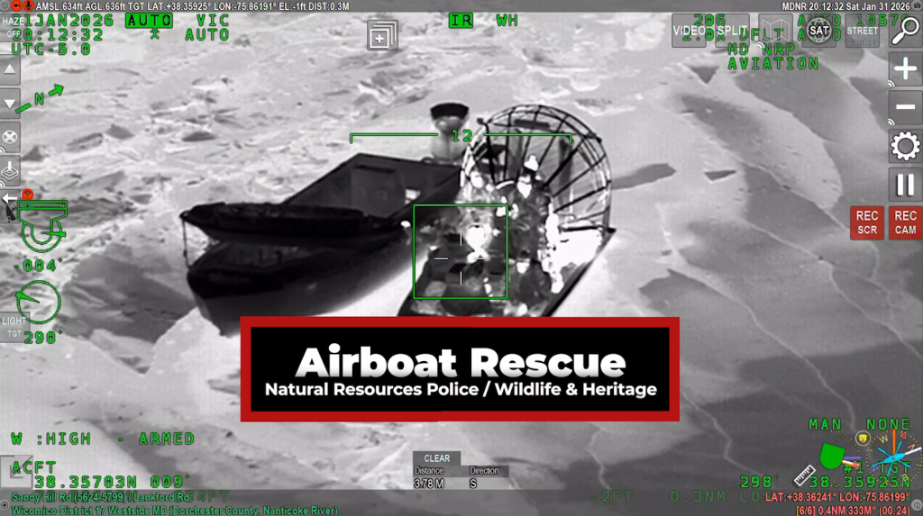 Thermal aerial image of boat rescue from a helicopter